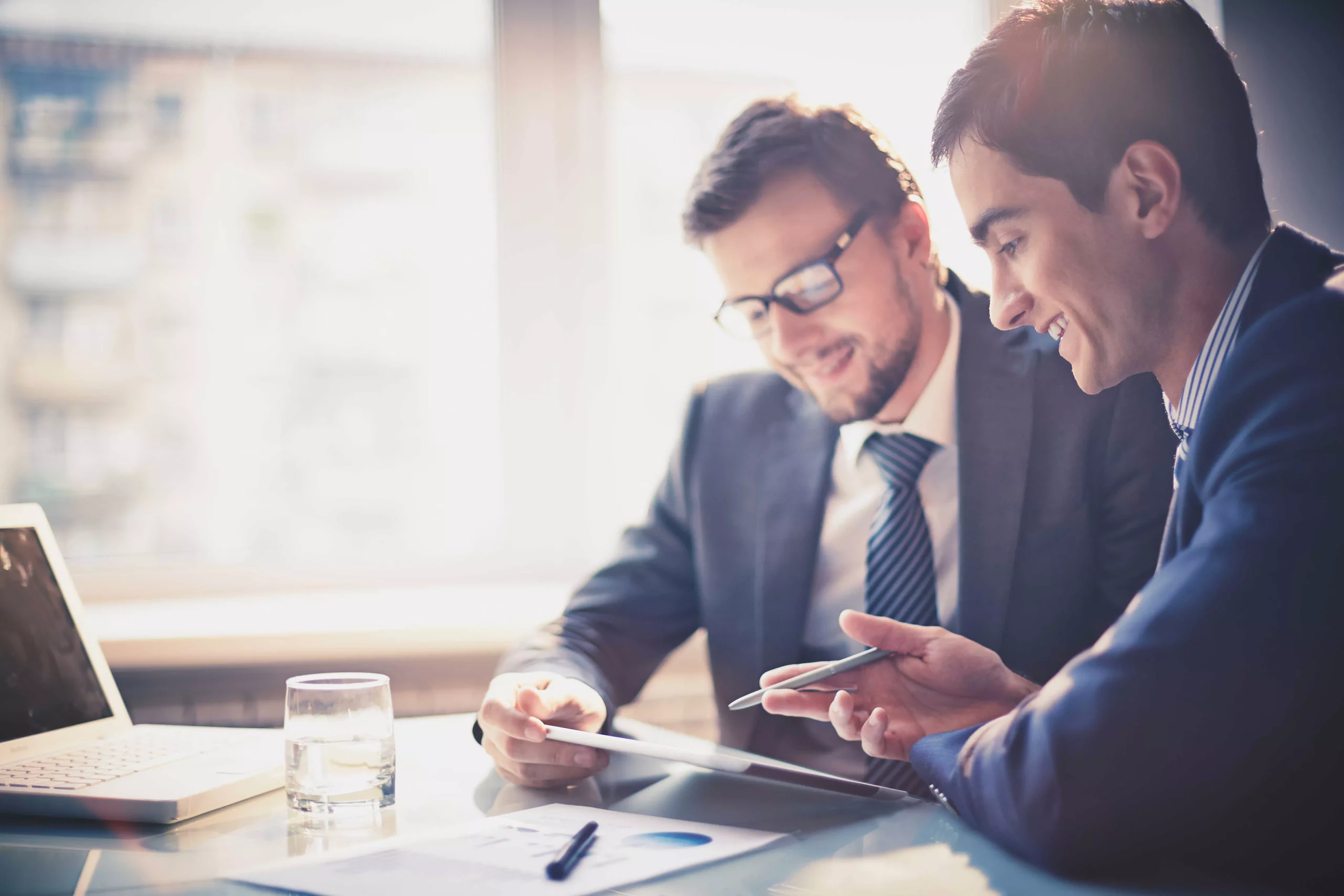 men reviewing factoring invoice receivables