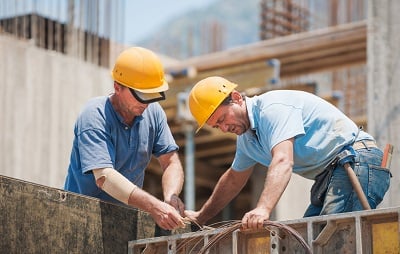 two men working on construction